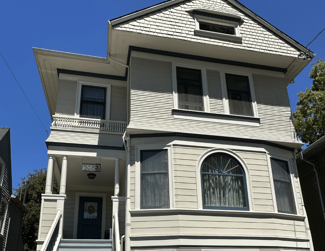 Exterior repaint of a cream Victorian home in Alameda