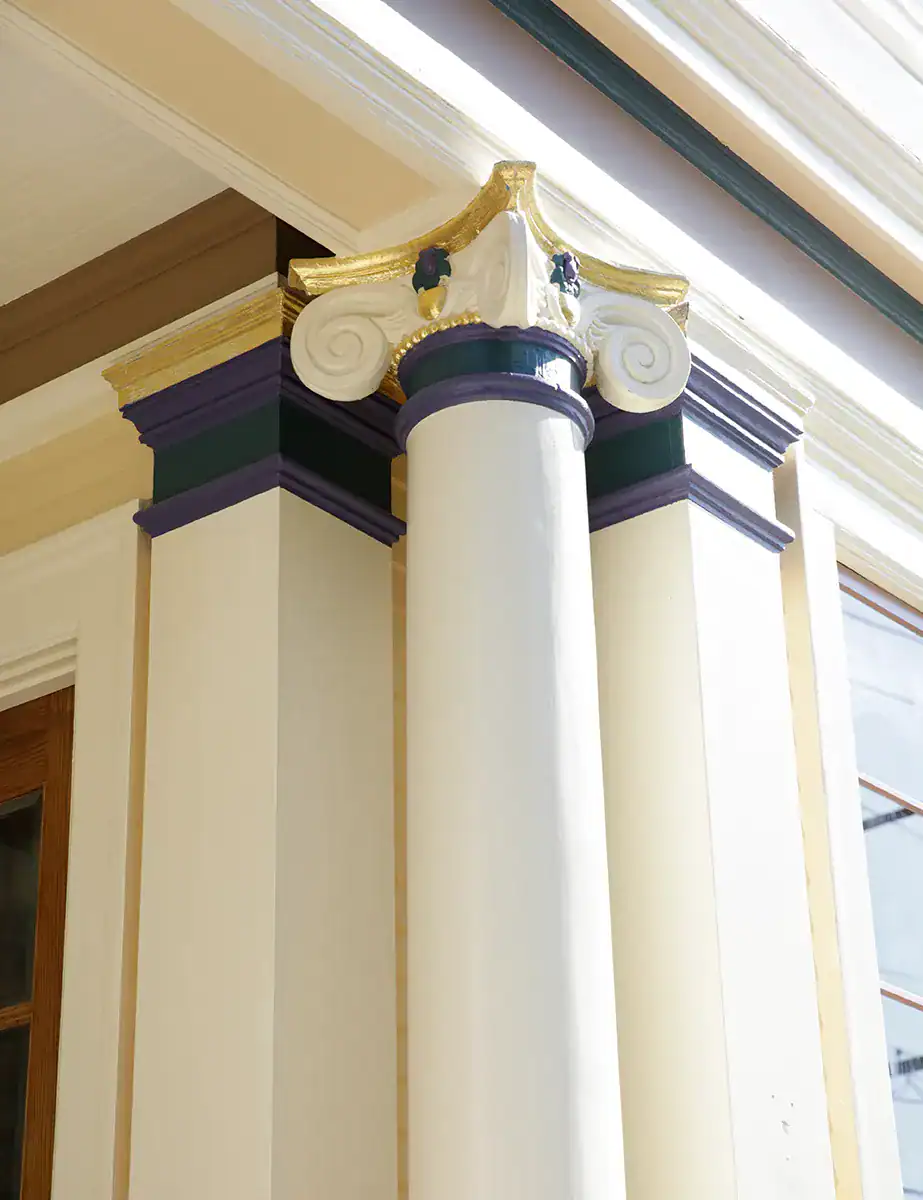 Gilded column capital and ornate exterior trim, finished by Arana Craftsman Painters