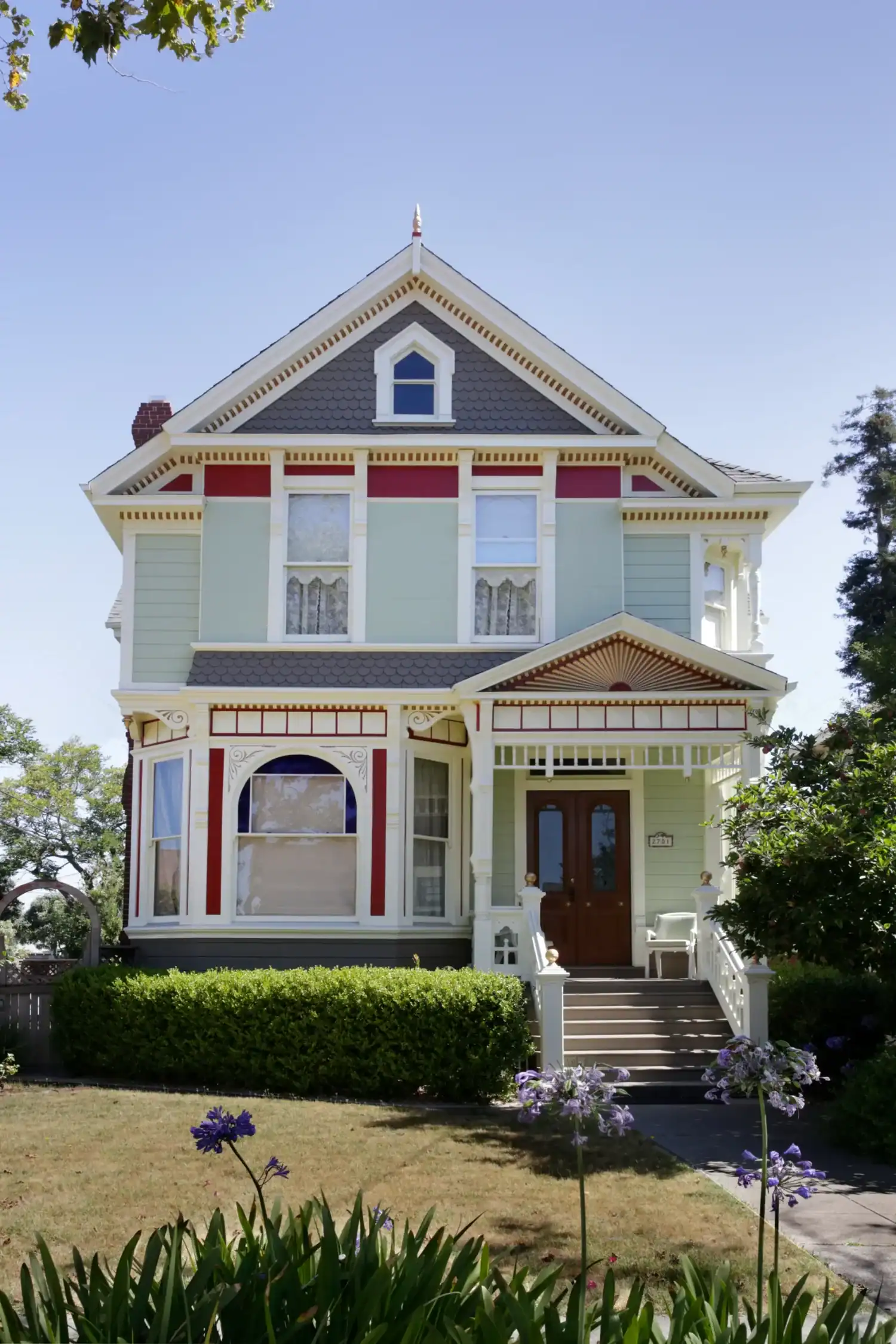 Exterior house painting on a restored Victorian in the East Bay