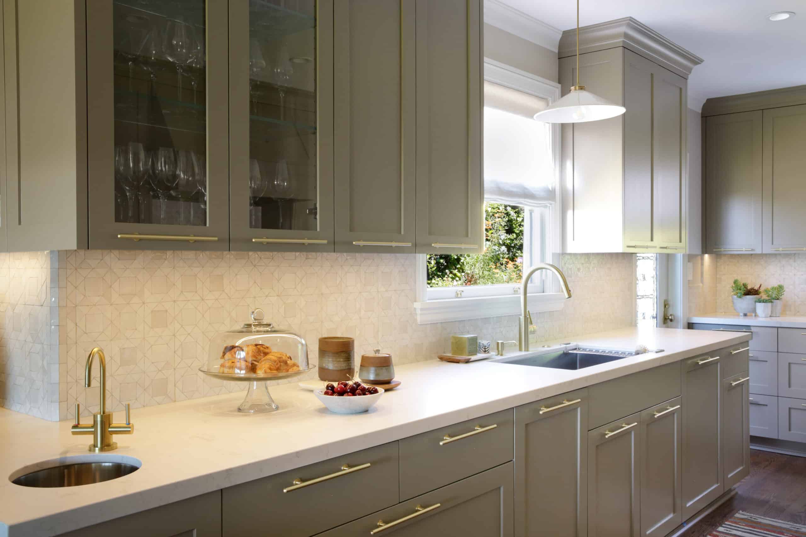 Sage green kitchen cabinets painted by Arana Craftsman Painters