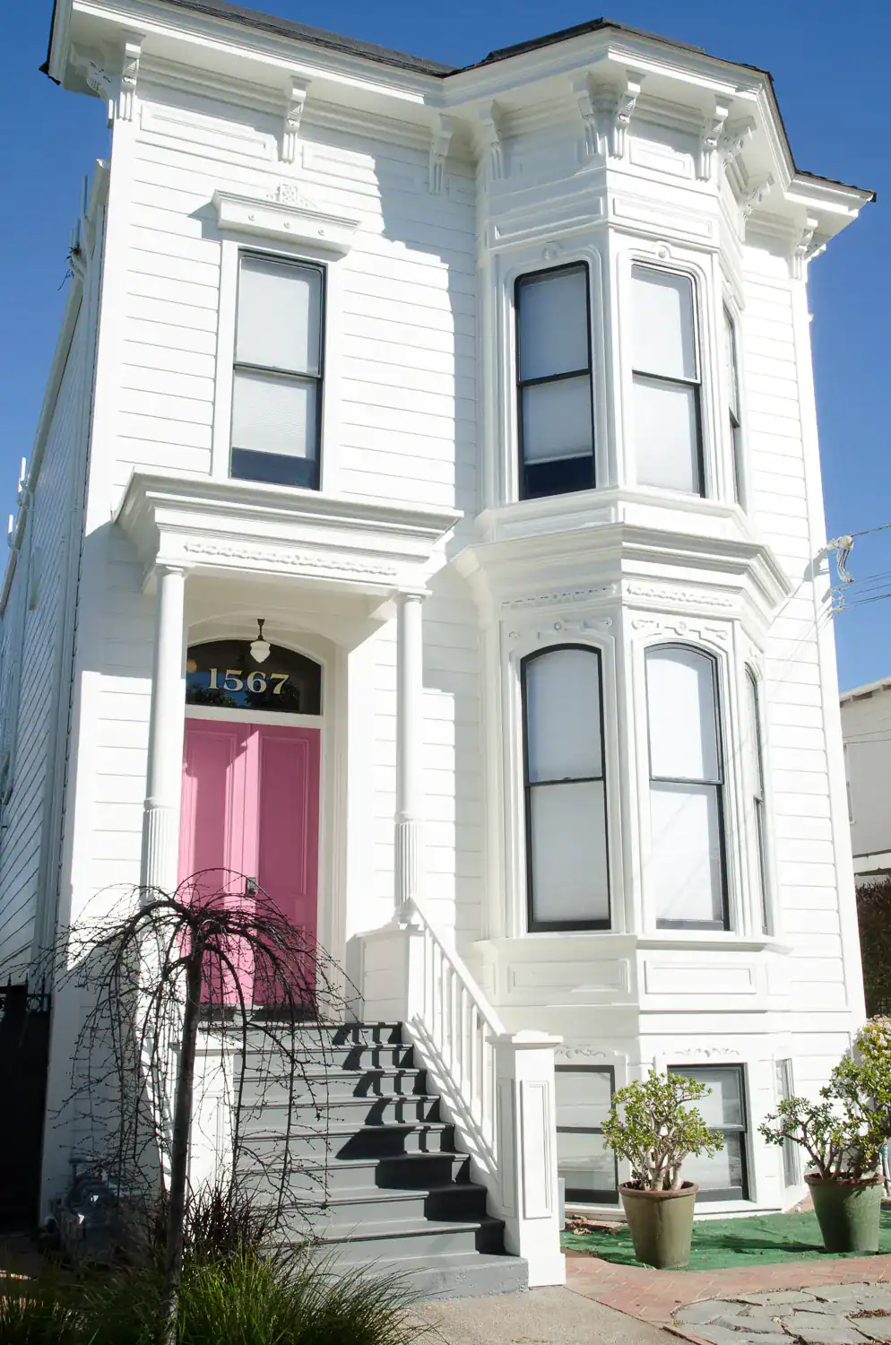 Exterior repaint of a white Victorian home in Alameda